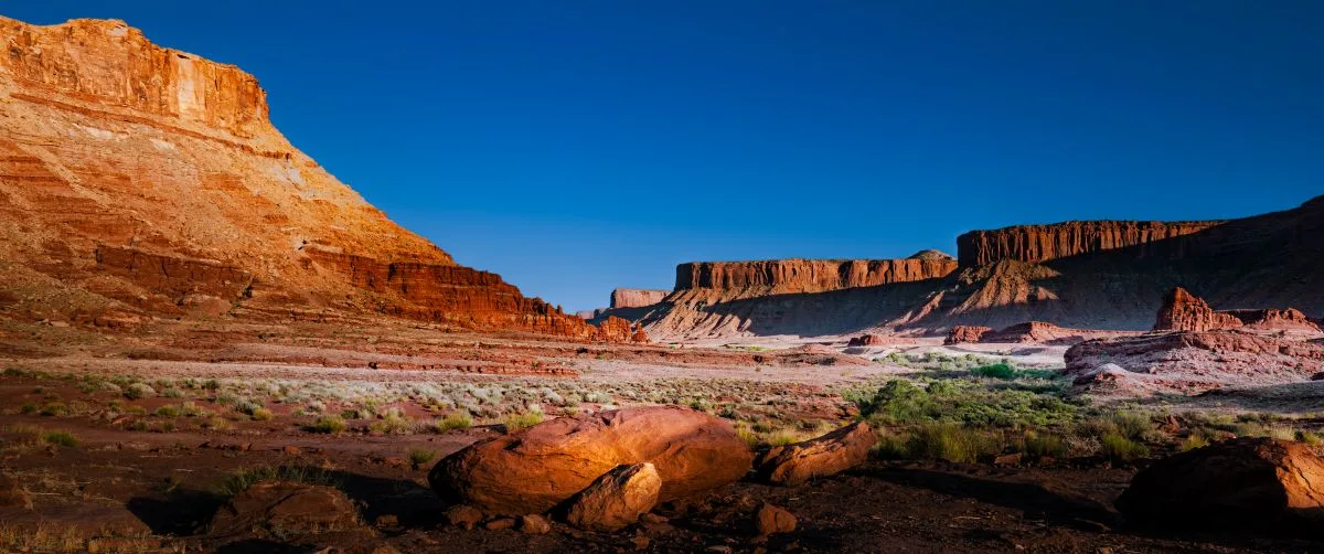 Red rock desert landscape under a deep blue sky